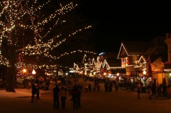 Leavenworth, WA at night is lit by many Christmas lights creating a festive atmosphere