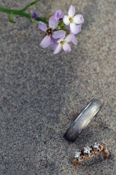 My wedding ring next to my wifes ring on the beach